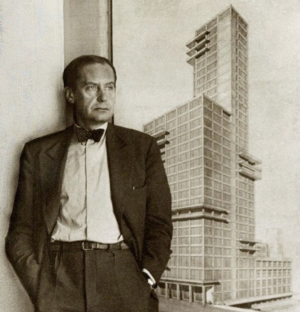 Walter Gropius standing in front of the rendering of his and Adolf Meyer’s entry in the 1922 Chicago Tribune tower design competition —an event which brought forth hundreds of submissions from architects all over the world. The design which Gropius and Meyer offered was formally aligned with what later came to be known as the International Style. Photo courtesy of The Charnel-House. Their in-depth article on the competition—and Gropius’ and Meyer’s entry in particular—can be found here .