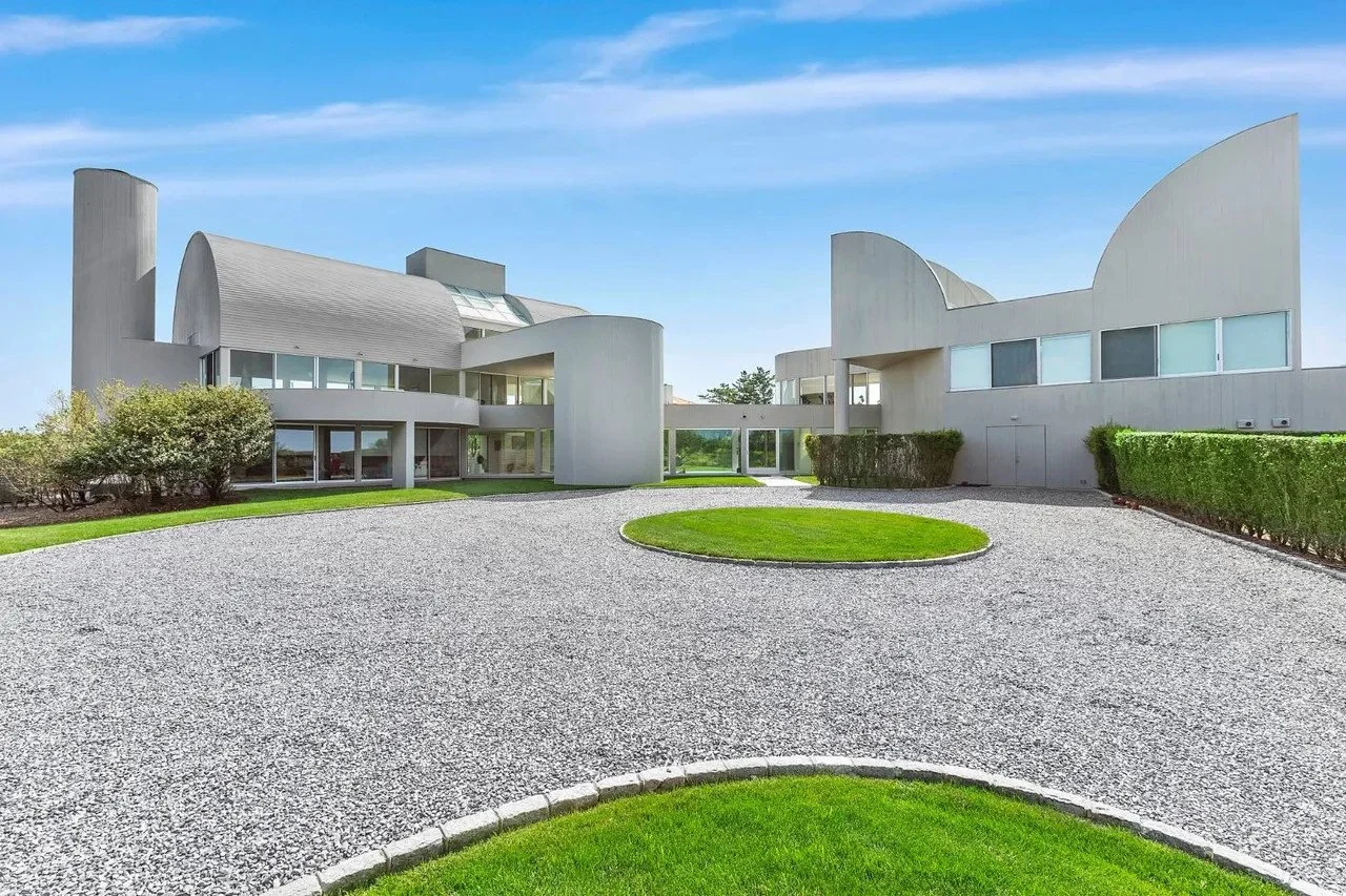 Current photos of the Conason Residence in Southampton, New York, designed by Myron Goldfinger in 1984. In 1992, Goldfinger designed a pool house addition with a connected walkway to the original residence. The two-story addition includes an indoor p