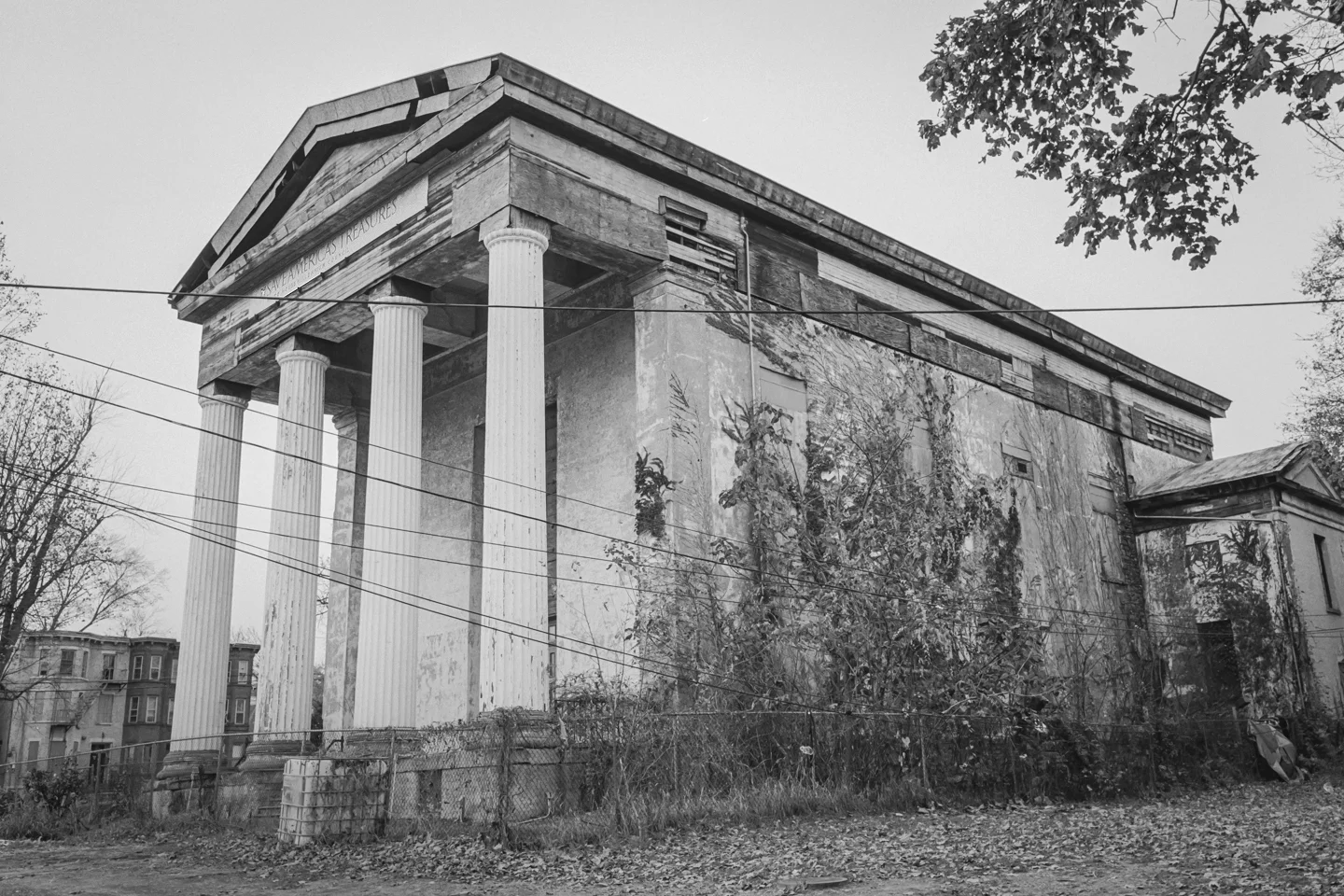 Community uproar ensued when the winning bid was announced, as a small but vociferous group of residents questioned the RFP process and the bundling together of the various sites. The city killed the project in late 2018 , and intends to rewrite the RFP. For now, the Dutch Reformed Church—like much of the city around it—sits vacant, wrestling with the legacy effects of renewal and collapsing under the weight of its own history, but peering out beyond its past with hope. (Visual essay by Cameron Blaylock.) (Text taken from the article, “ Renewal’s Toll on Newburgh ,” ARCHITECT Magazine, April 2019 - by Ben Schulman .)
