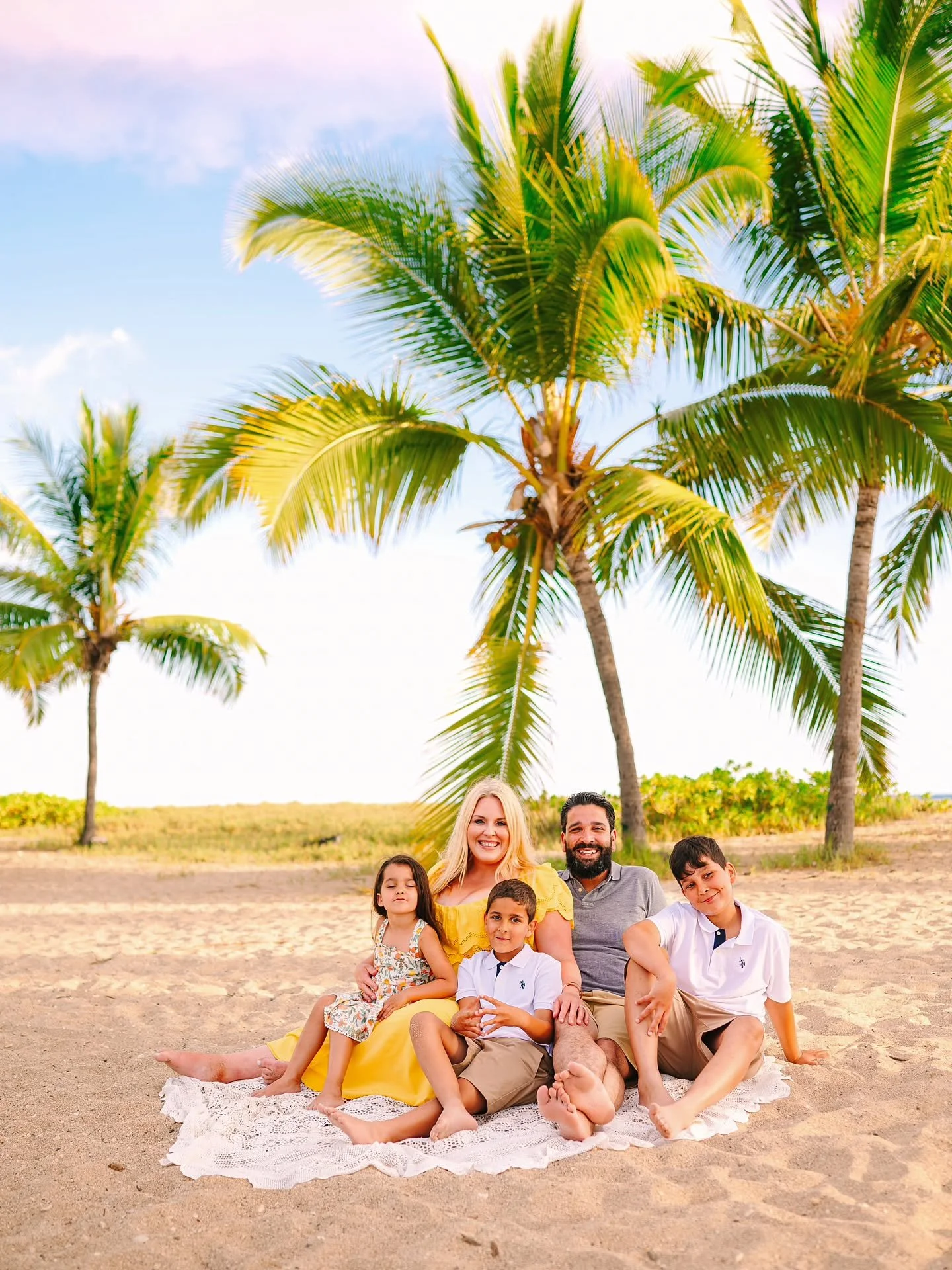 Blue skies, palm trees swaying, a cozy crochet blanket, and your favorite people all snuggled together&hellip; honestly these are the kinds of photos that end up framed in your house forever.

And the best part? Your session doesn&rsquo;t have to fee