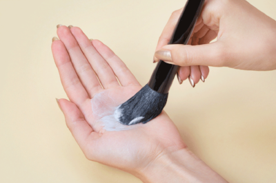 Flip the brush downward and rub the brush in the palm of your hand, using a circular motion.