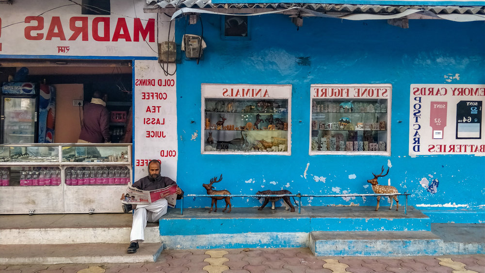  After the visit to a dharamshala, I met a man whom I dared not disturb. He was reading a paper at high noon. When I passed by an hour later he hadn't moved an inch. 