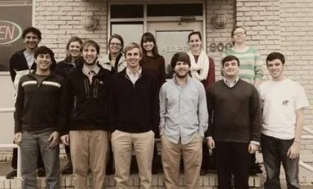 The company in the early days of Forza Financial under the two main founders, David Bailey (bottom row, second to the left) andTyler Evans (bottom row, far left).