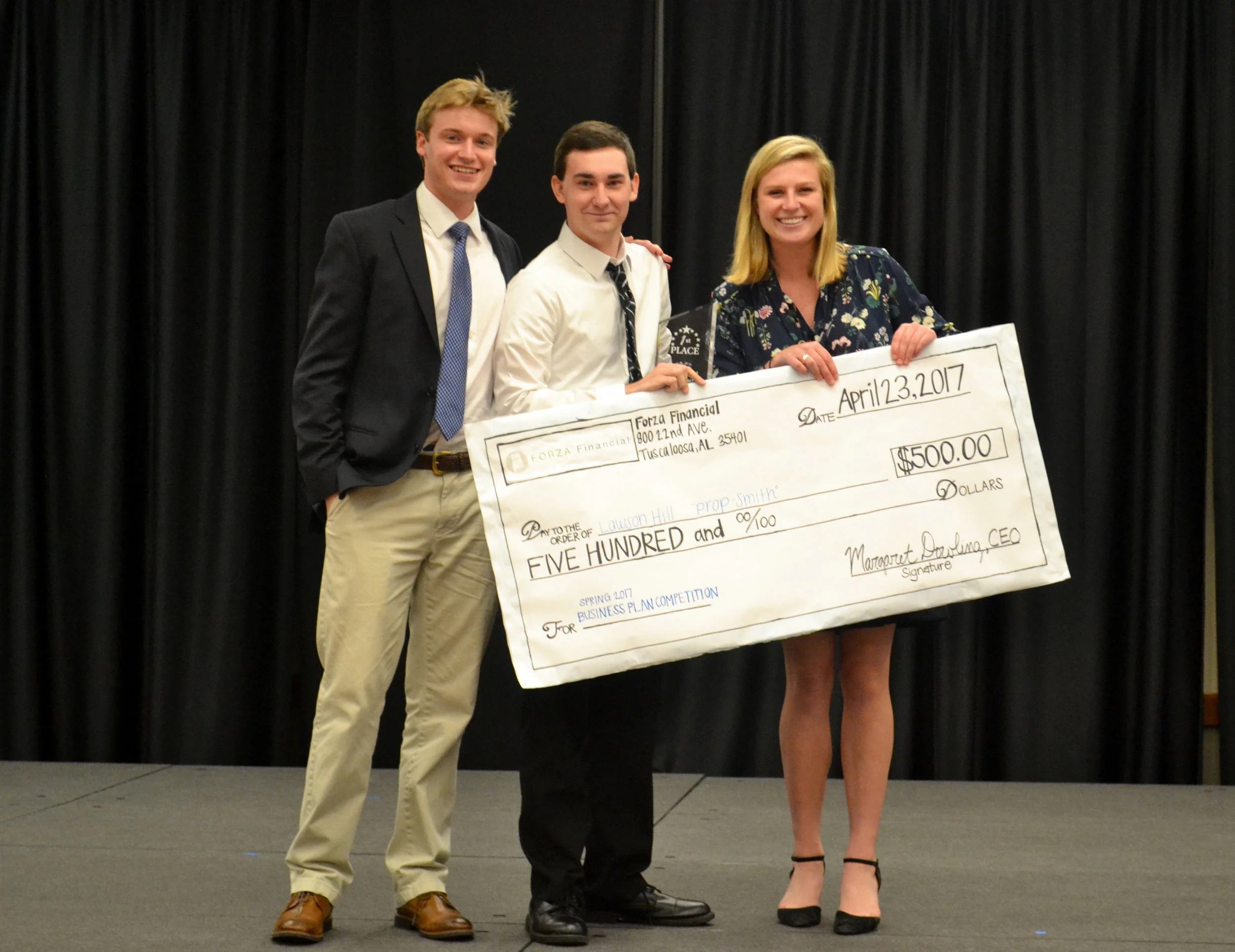 Lawson Hill, the 2017 Forza Financial Business Plan Competition winner, stands with then CMO Jon Hanley and CIO Fig Stallings.