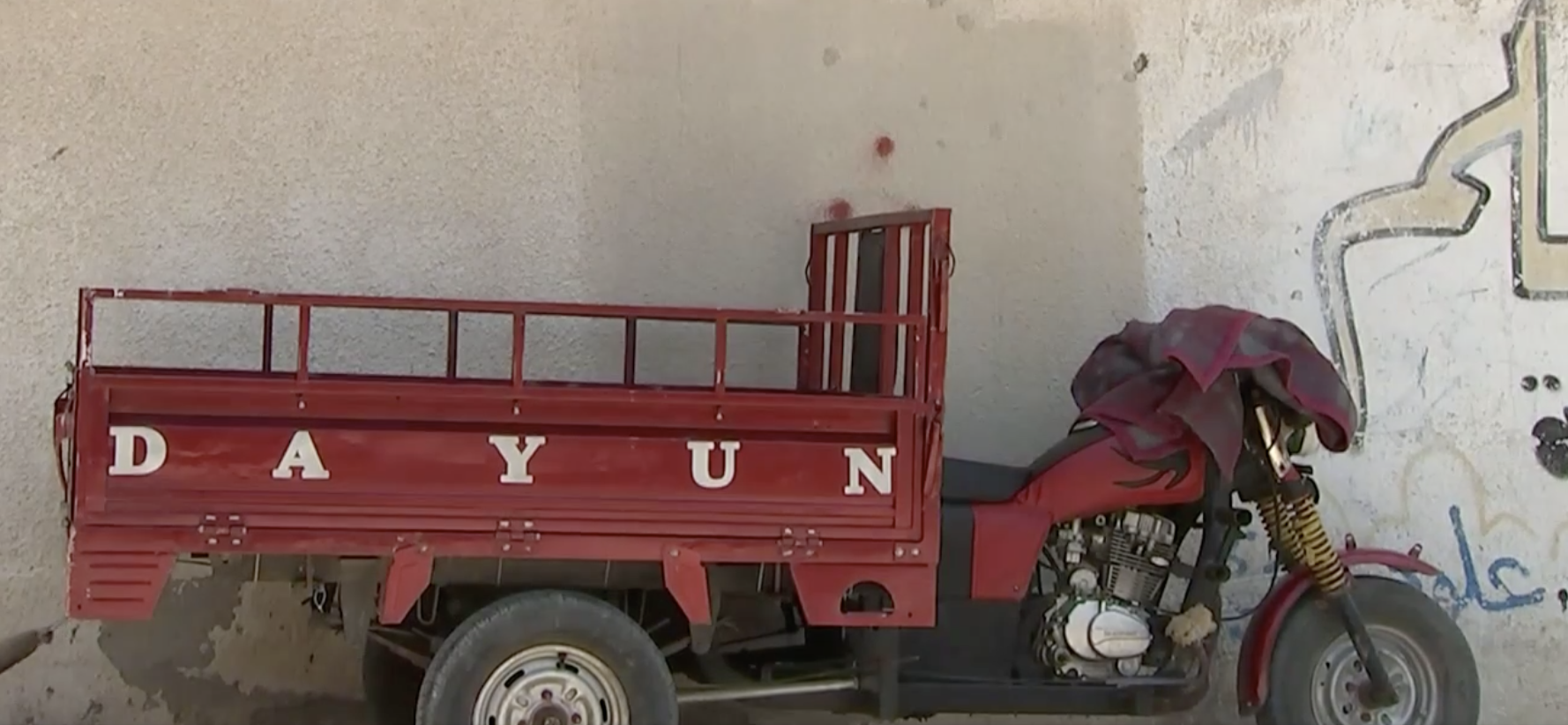 The tuktuk that Mahmoud's older brother was driving when Mahmoud was hit. There were 4 children in the back; they were 500 meters from the fence and just driving to meet thee crowds when an Israeli sodlier opened fire on them.