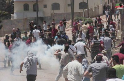 A protest in Kufur Qaddoum, as Israeli soldiers attack.