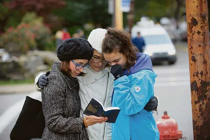 Finding comfort in prayer. AFP