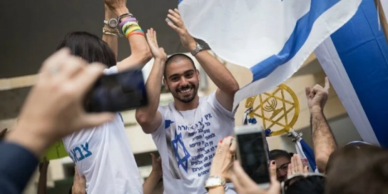 IDF Sgt. Elor Azaria, the Israeli soldier who shot dead a neutralized Palestinian attacker in Hebron on March 24, 2016, seen after his release from military prison, as his family celebrates his return outside their home in Ramla on May 8, 2018. Photo: Hadas Parush/Flash90
