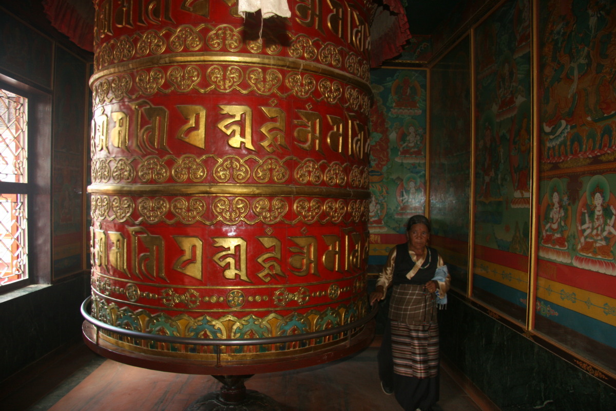 Large prayer wheel in Tibetan temple at Boudhinath