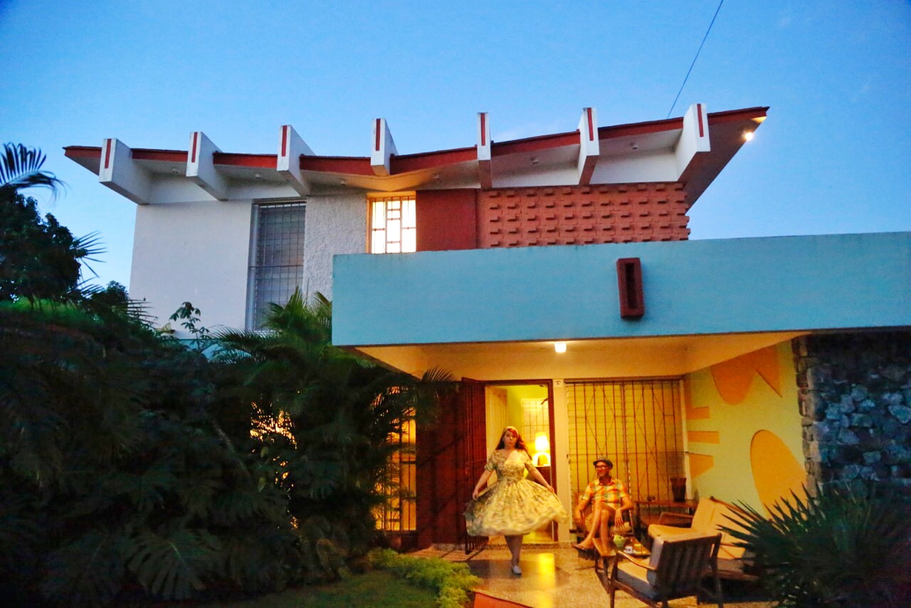 Nicole and Jonathan enjoy an evening outside a mid-century house in Cojimar.