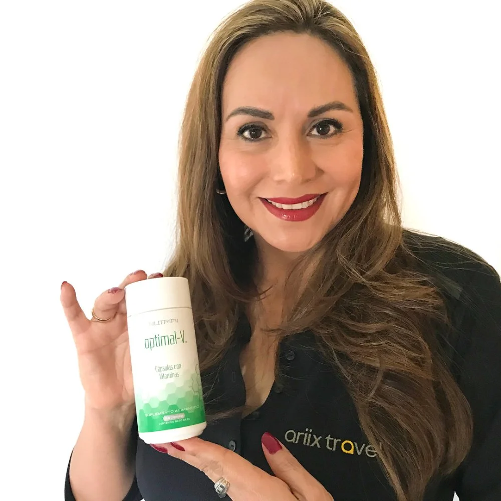 Woman Holding a Bottle of Nutrifii Optimal-V Multivitamin Supplement