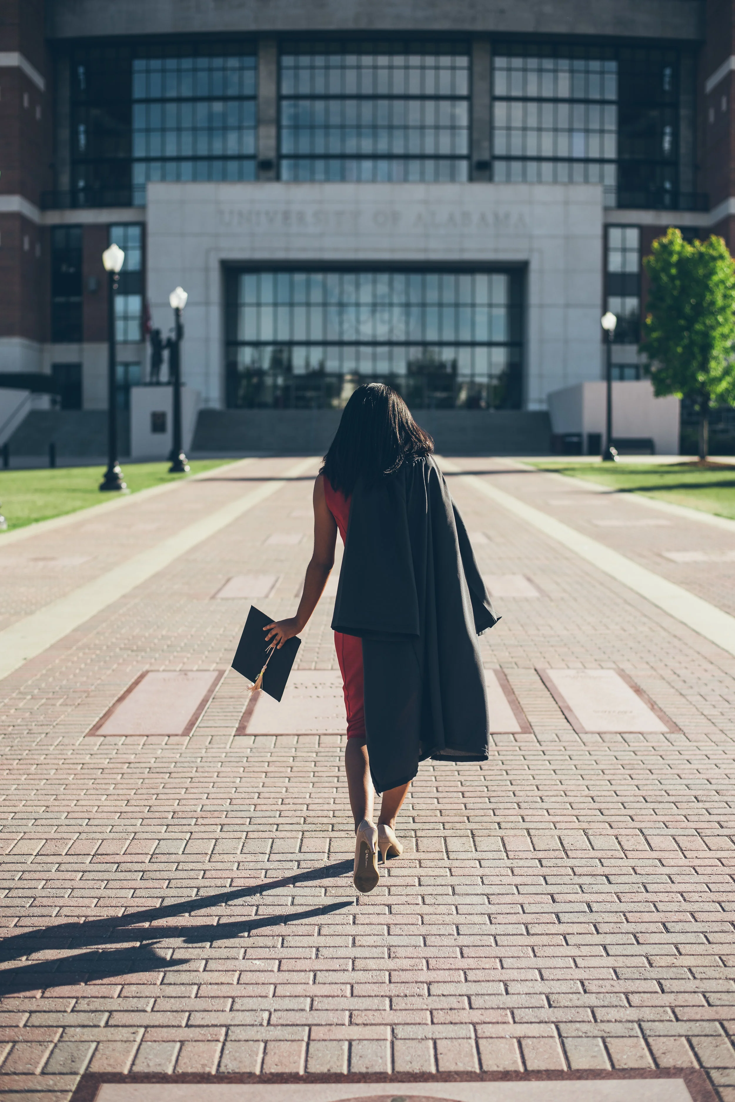 As a college student, should I continue investing or save to pay off my debt first?