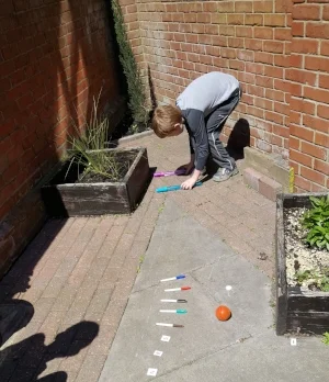 Joseph (year 4) creating his own hand gym assault course to aid his fine motor skills for handwriting.