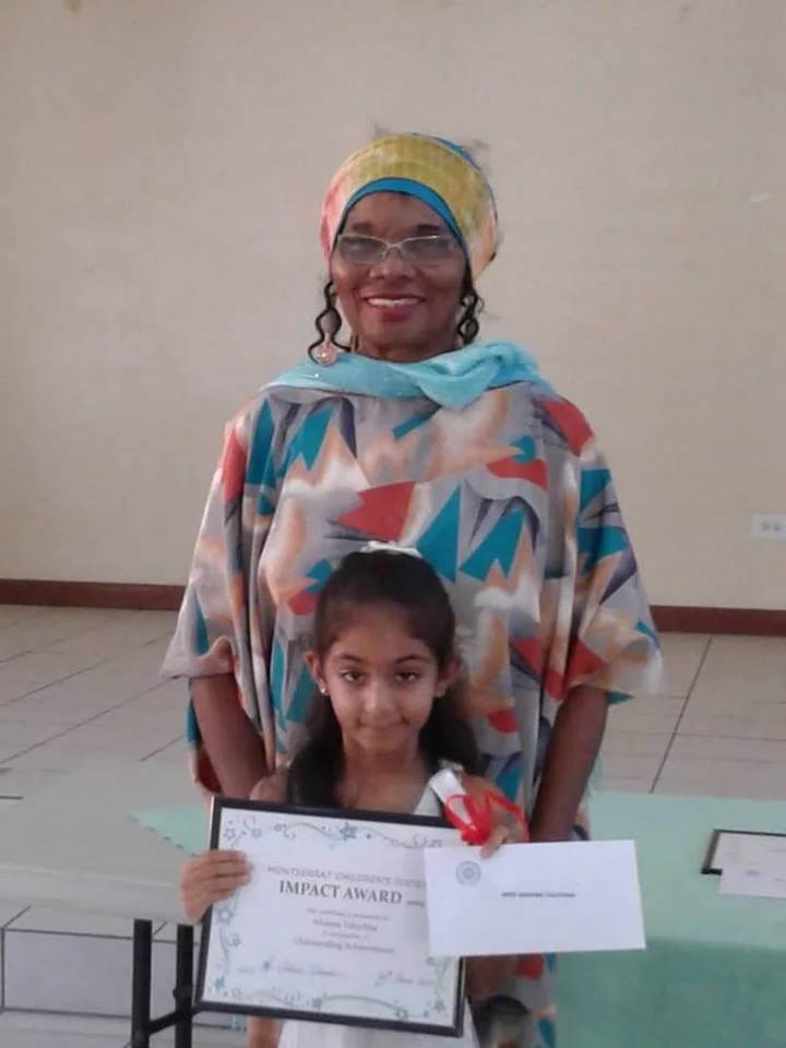 Ahanna receiving her award from Ms Rose Willock. Photo Credit: Agnes Lempiere