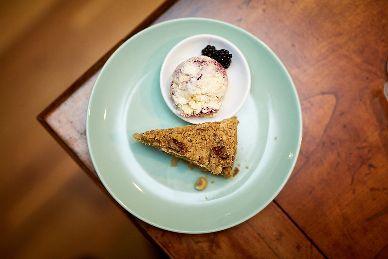 Apple and cinnamon streusel cake with blackberry and bay ice cream