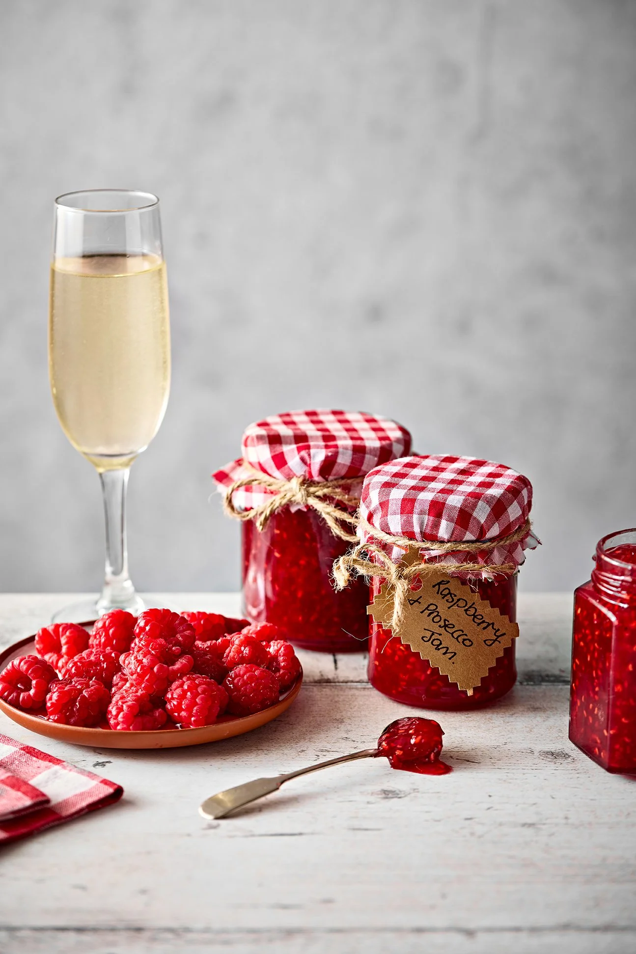Raspberry and prosecco jam with glass.jpg