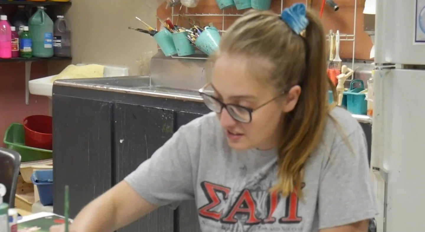 You'll find Trisha at the DCA teaching kids classes, like the popular Anime Academy, or fun adult workshops like painting, henna, and alcohol inks! Here's a little more about her in this video. https://loom.ly/31OZ8kM