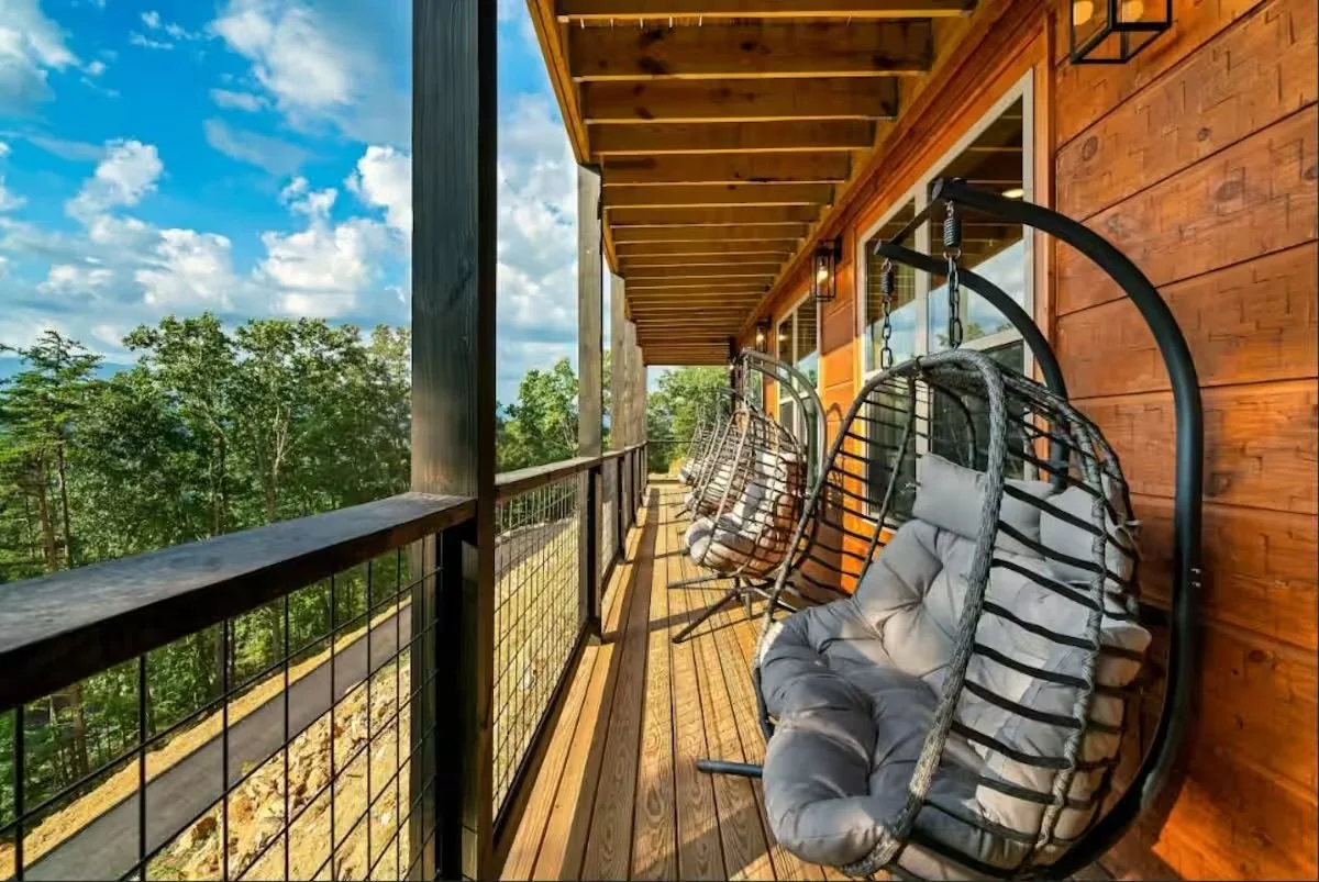 2026 porch with hanging chairs.jpeg