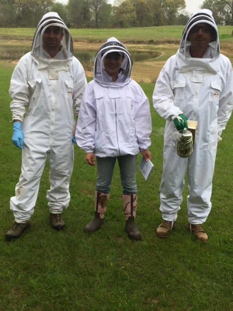  Rick, Jana, and Barron headed for the bee yard. 