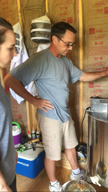  Spinning the honey off of the frames of comb. 