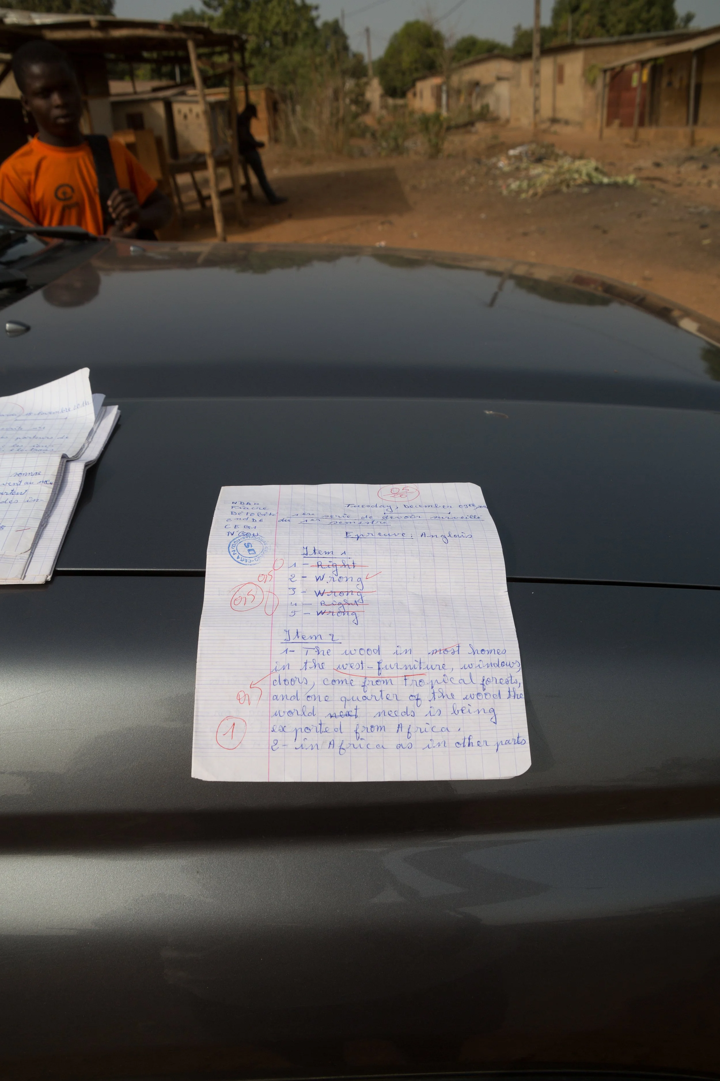 (His school notebook: words in French and English, his ambition taking shape in ink.