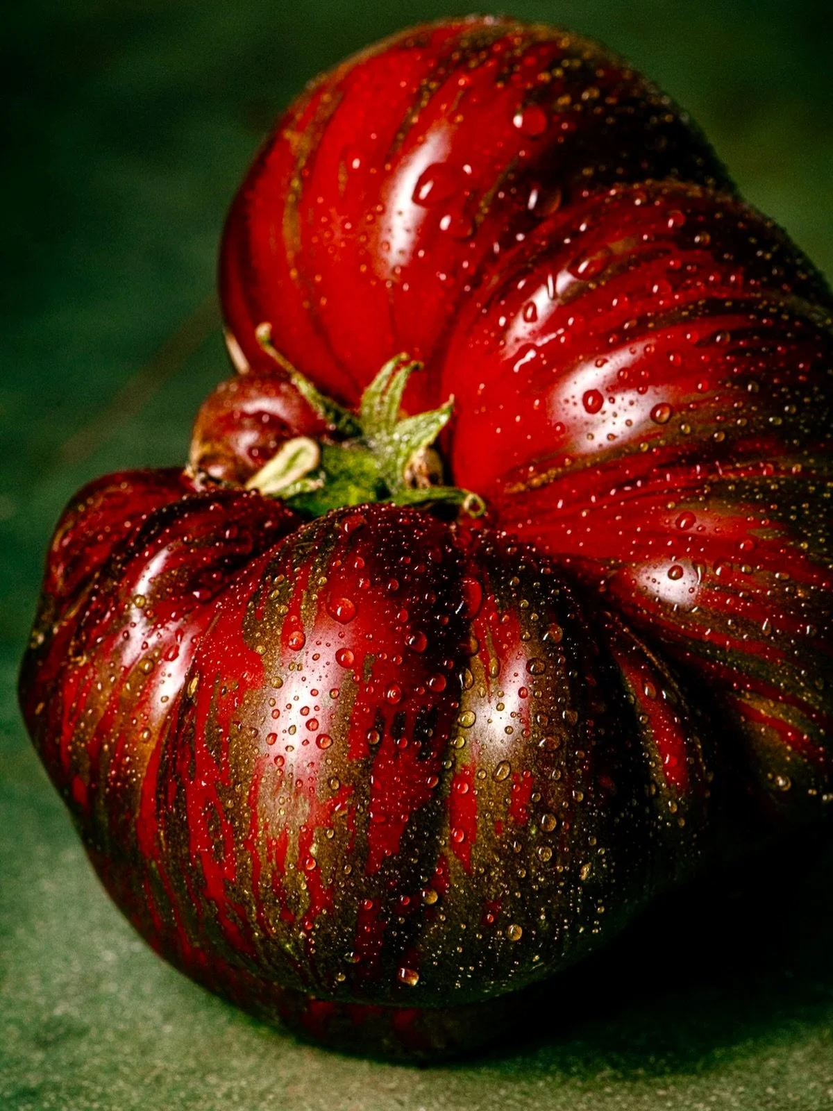 Let the tomato portraits begin. First up, Pink Berkeley Tie  Dye 🍅. Seeds from @westcoastseeds. Super juicy and delicious. Perfect for tomato sandwiches. 

#mushroomsandthyme #tomatophotography #stilllife #moodyfoodphotography