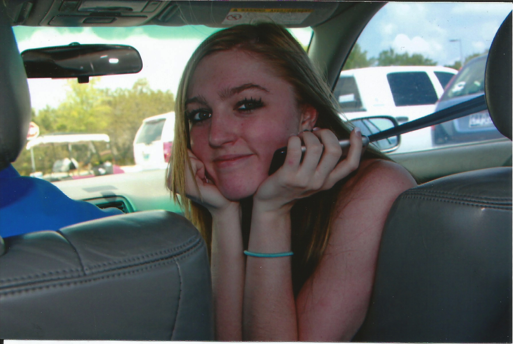 Caitlin smiling in car just graduated.jpg