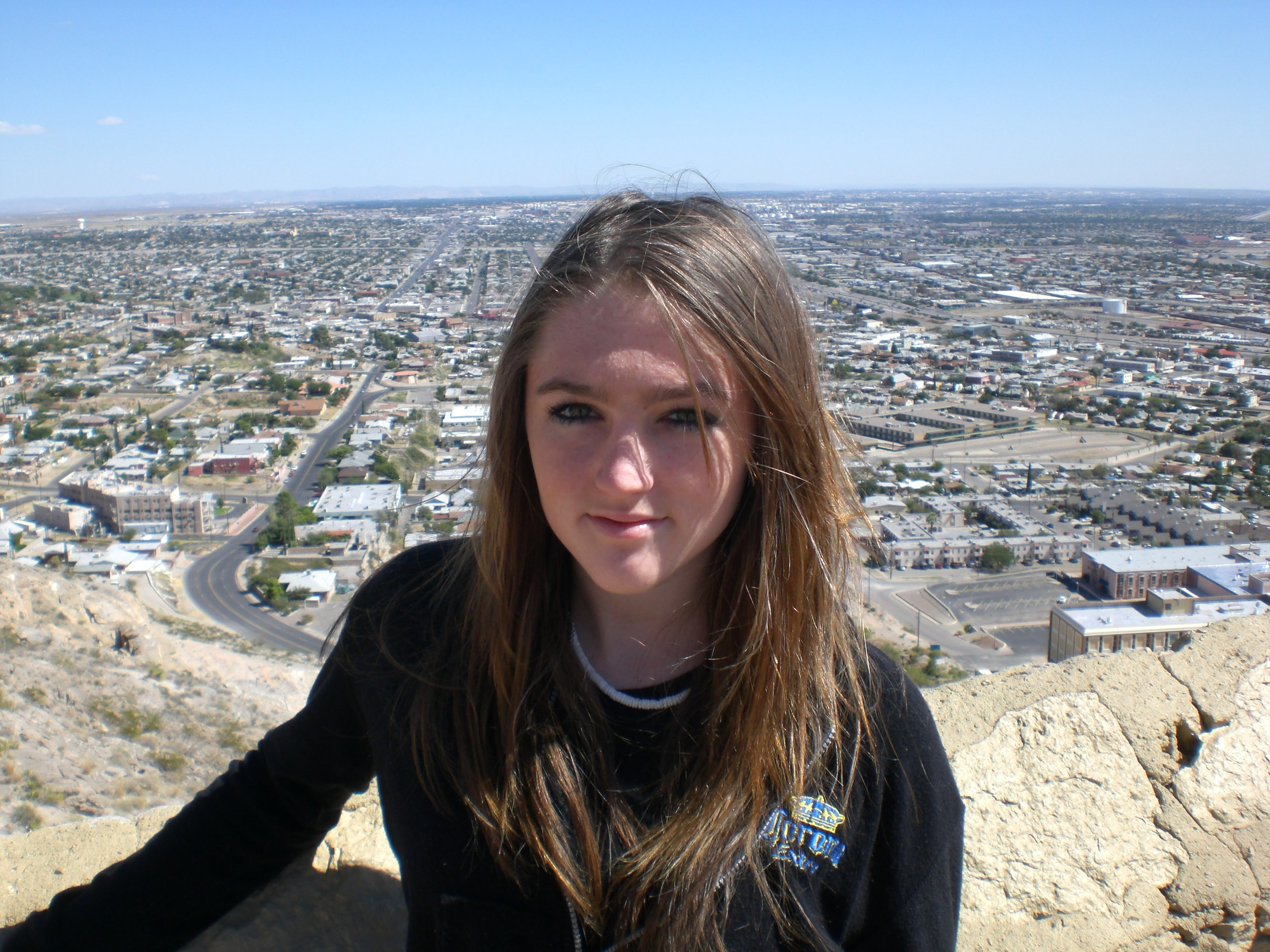 Caitlin portrait in front of El Paso skyline 6 7 2009.jpg