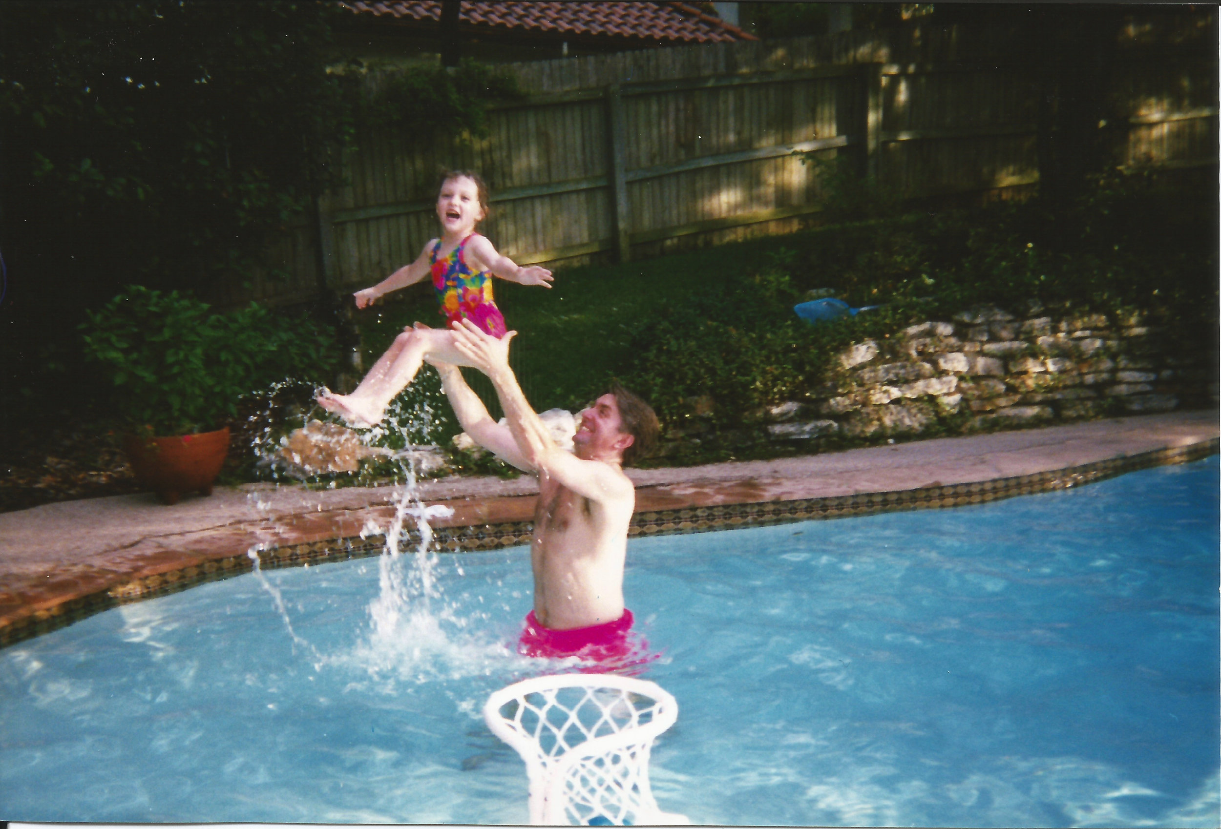 Caitlin flies up from pool with Daddy.jpg