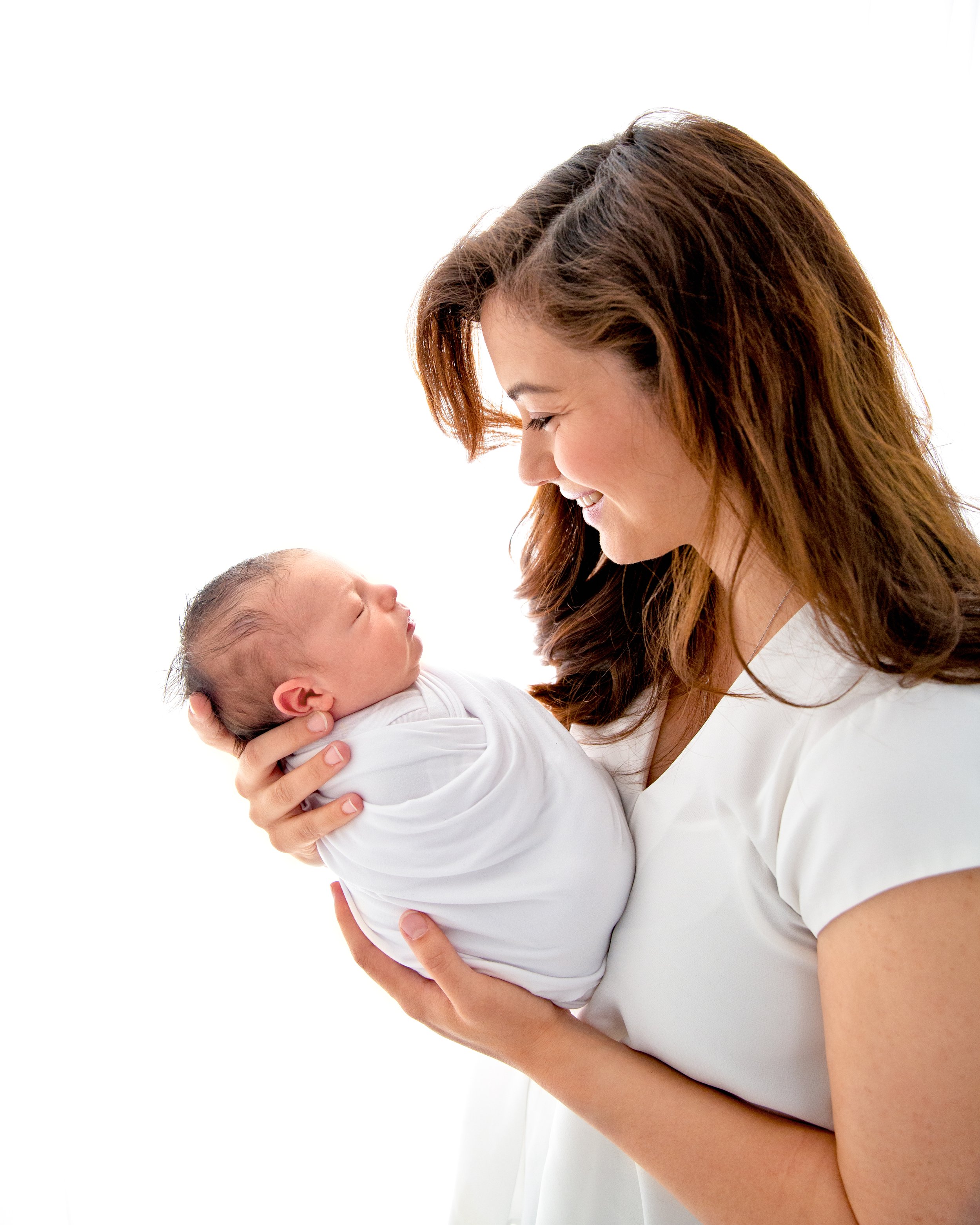 mom holding newborn baby 