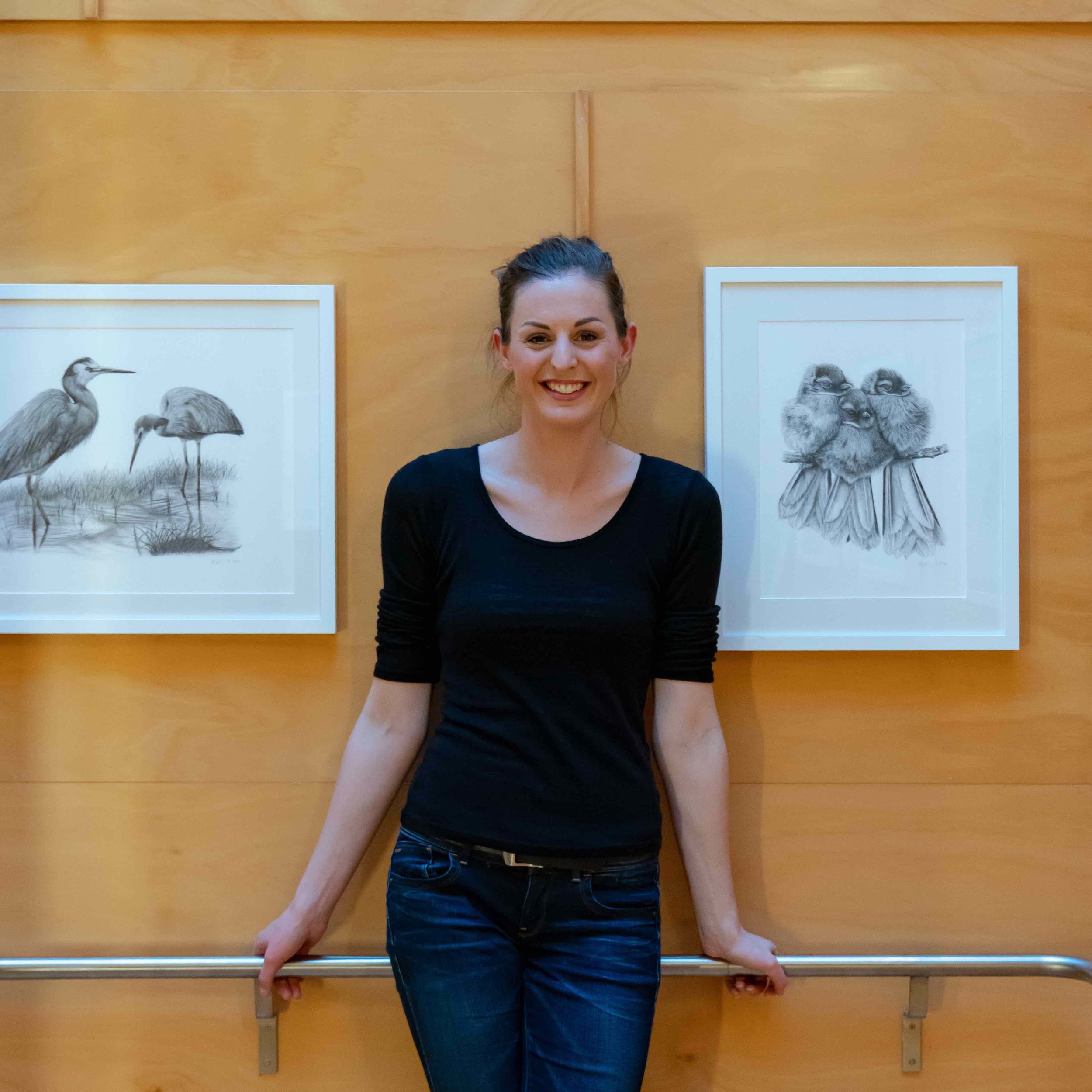 Hannah infront of her framed artwork at Zealandia.jpg