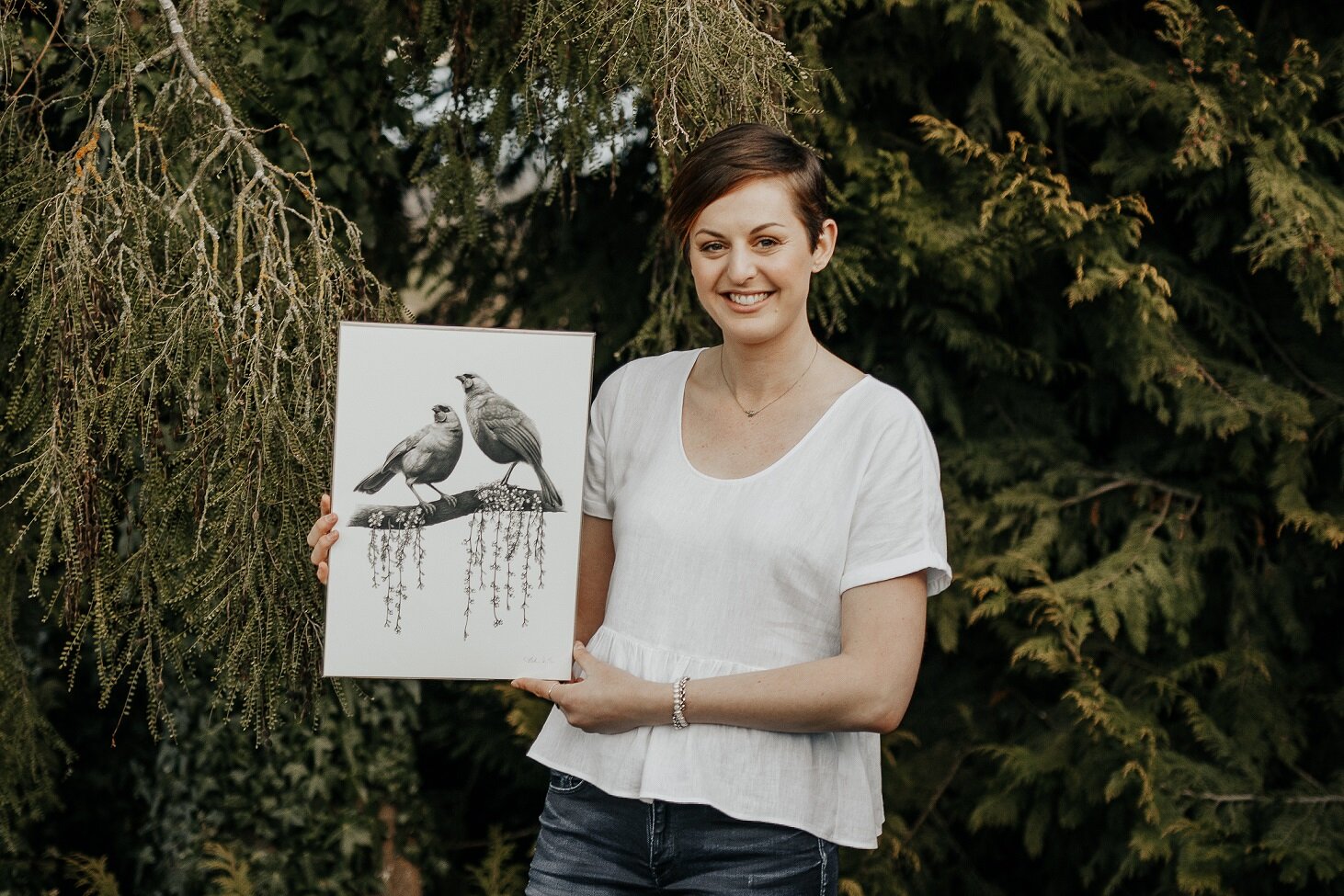 Hannah Shand holding kokako companions artwork.jpg