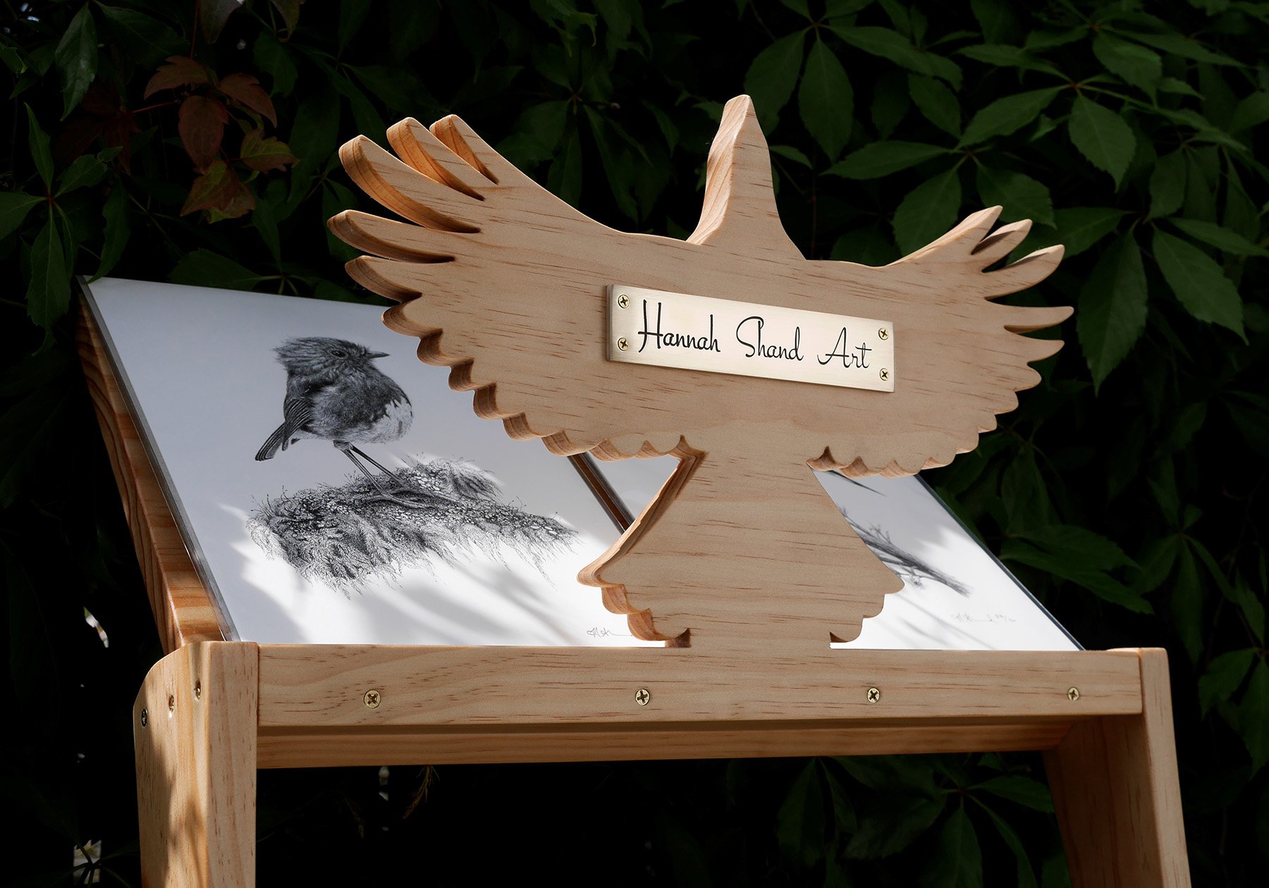Hannah Shand Artist custom print rack with bird silhouette and brass plaque.jpg
