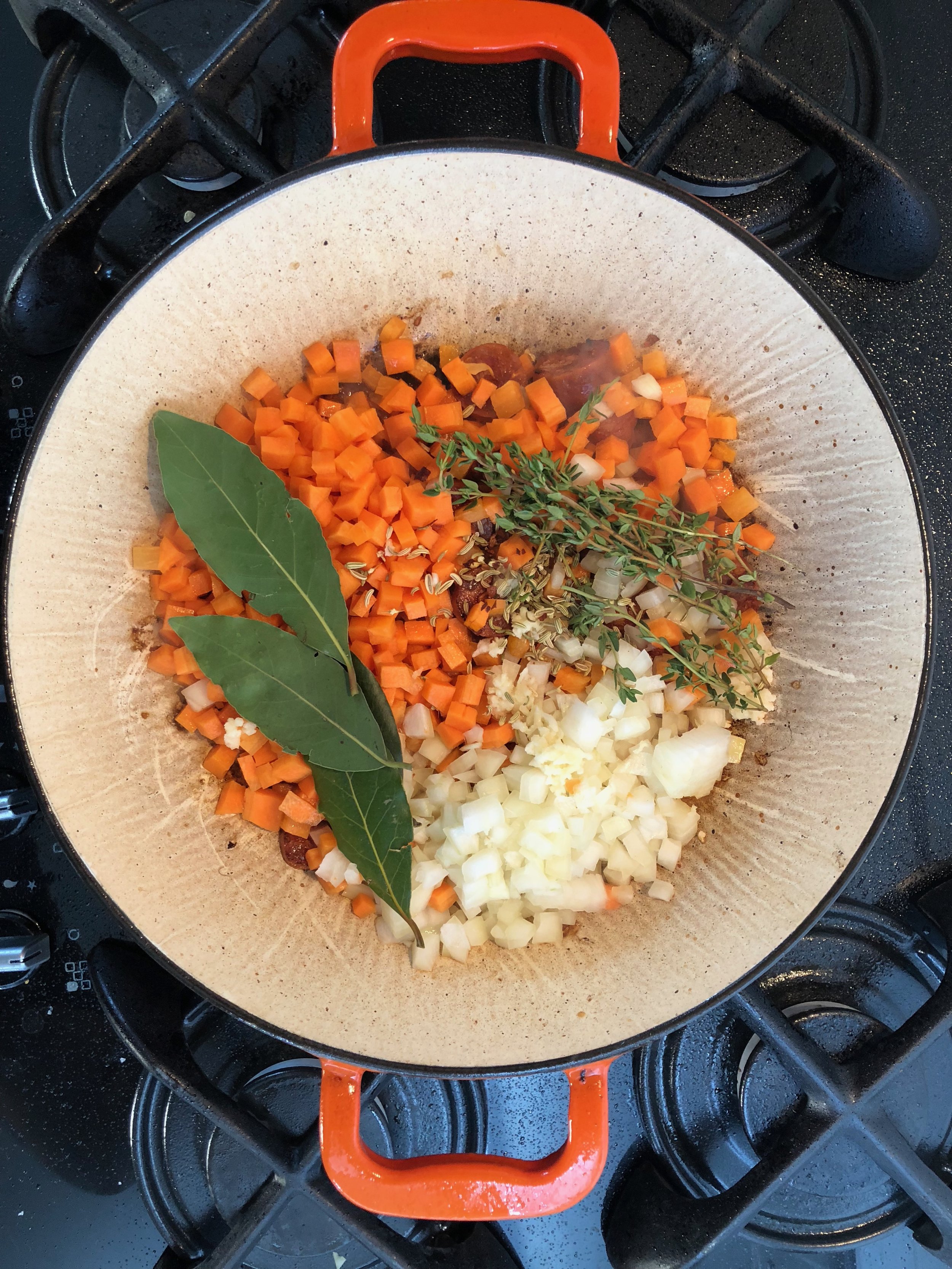 Add the veg, herbs and garlic