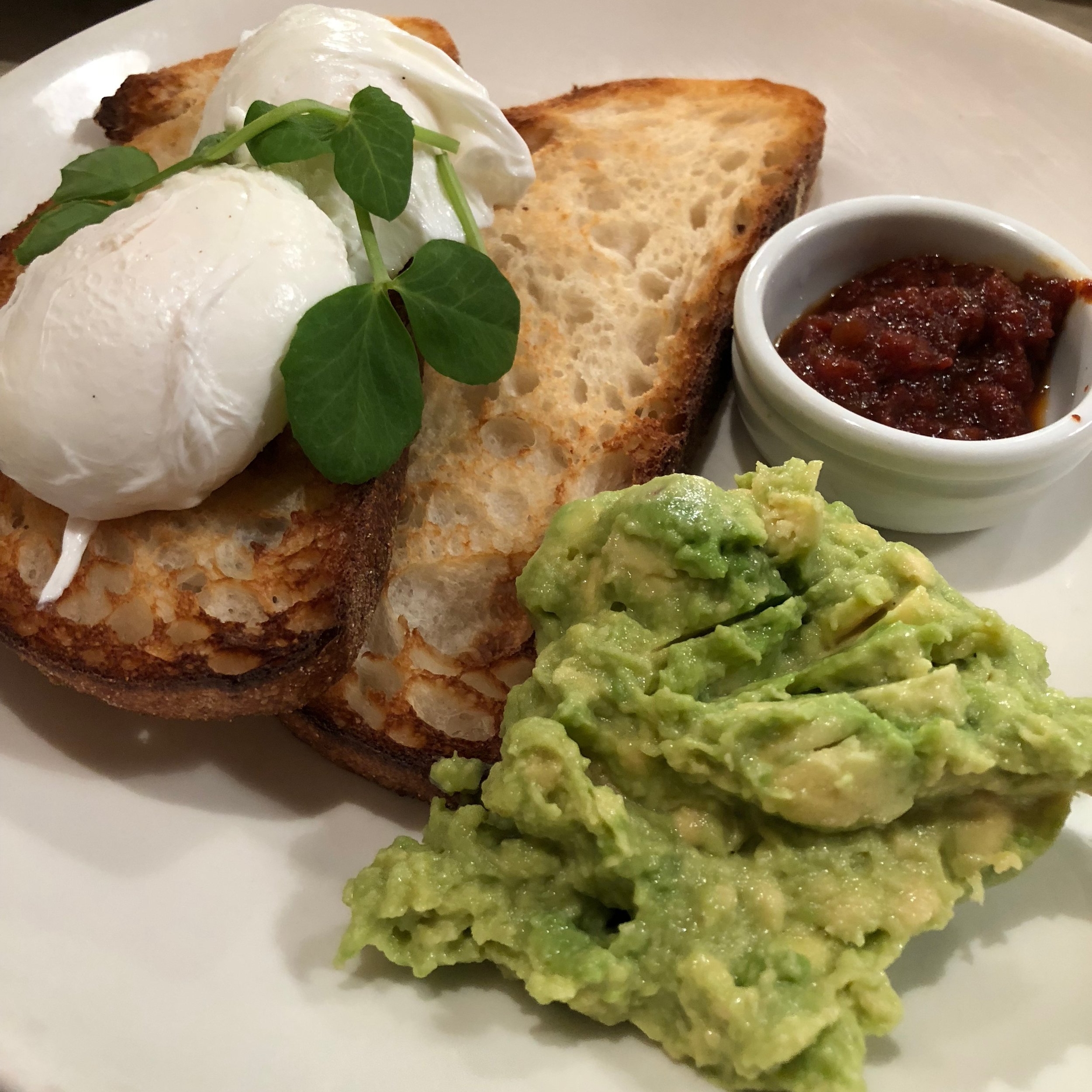 Poached eggs and smashed avocado
