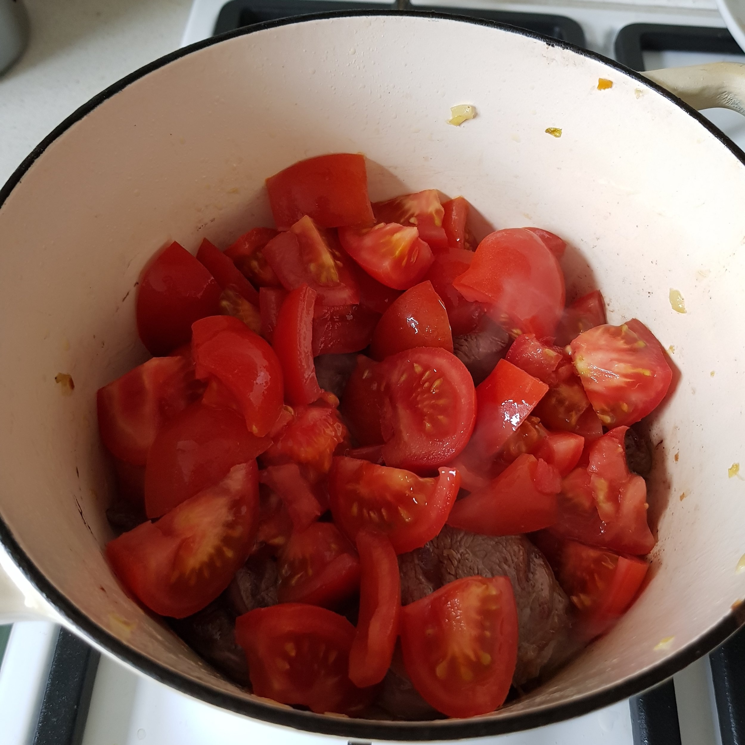 Add fresh tomatoes to the pot