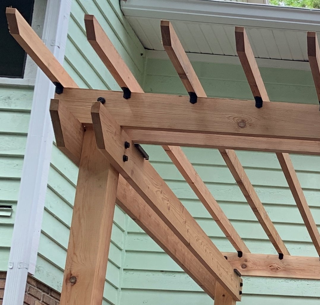 pergola detail matching bolts and brackets with lighting.jpg