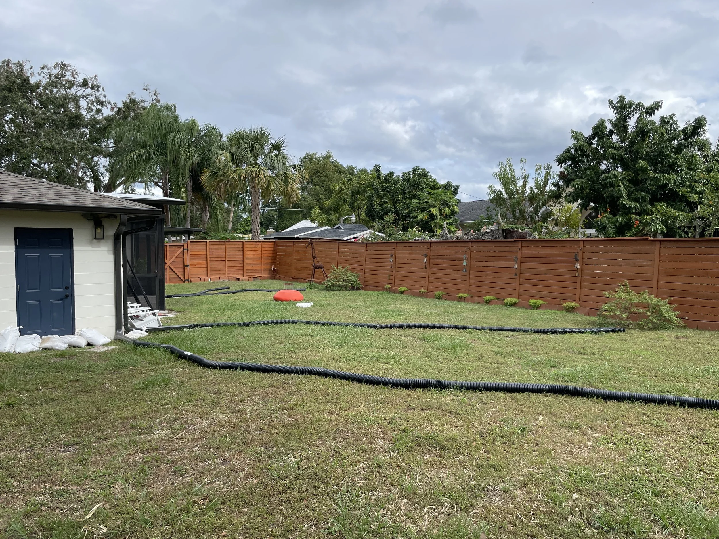 Backyard landscape project before picture illustrating drainage problem.JPG