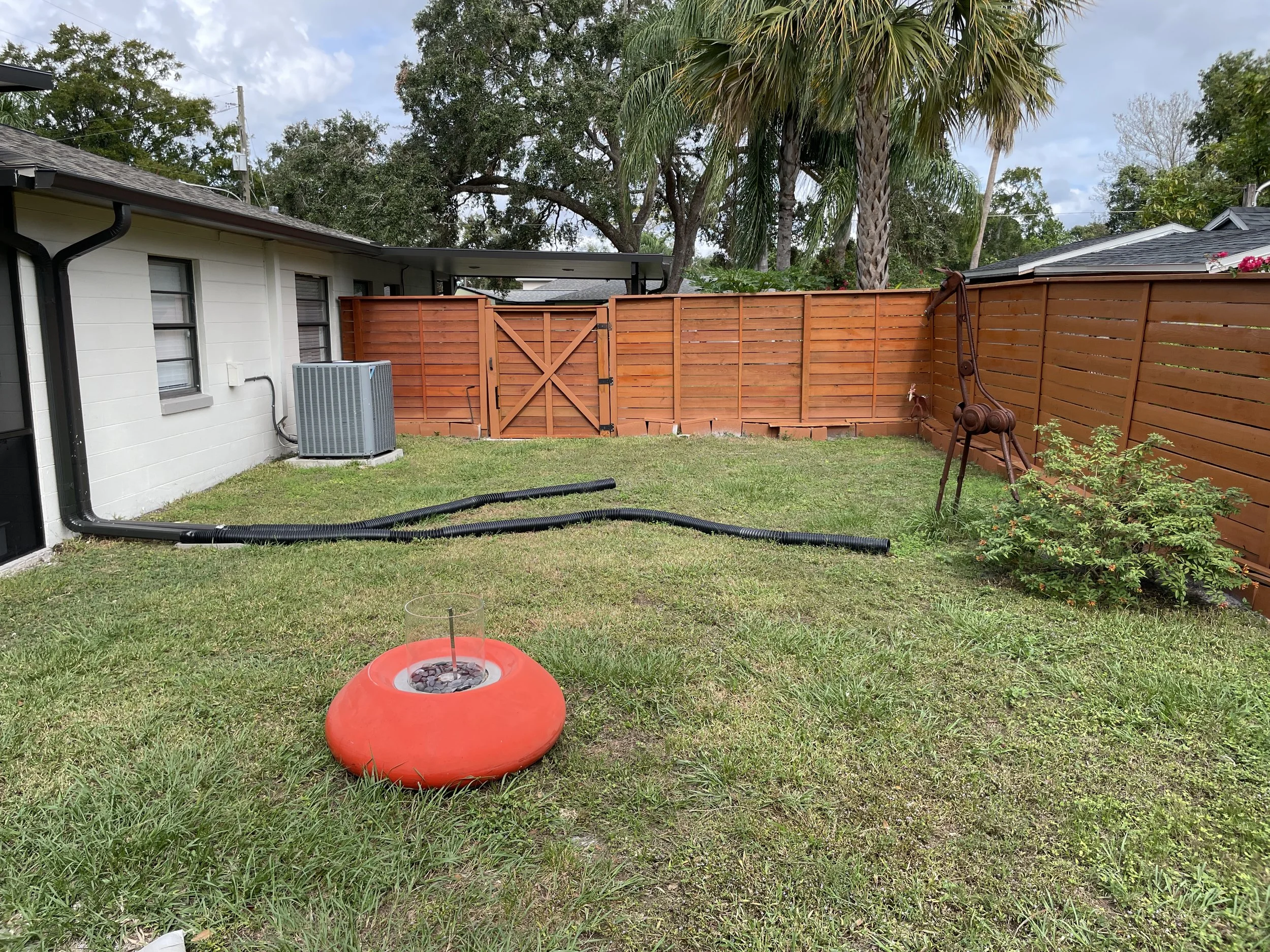 backyard landscape project showing gutter and drainage problem.JPG