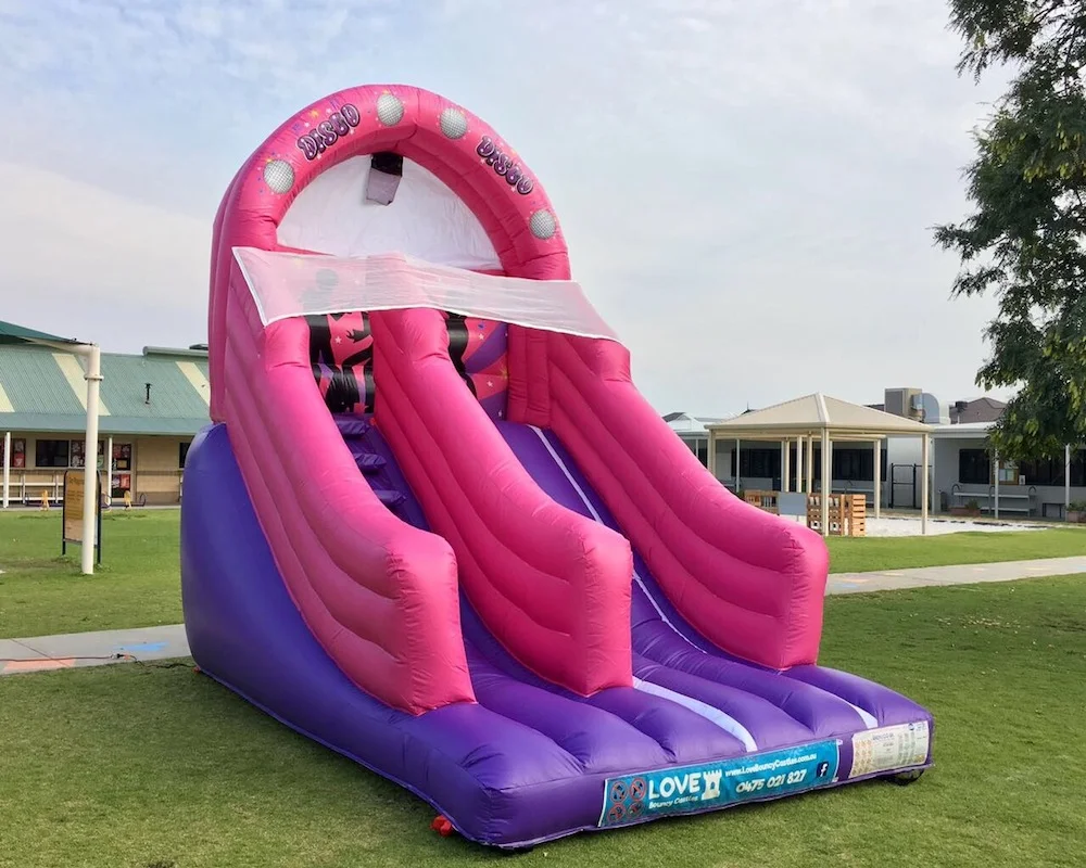 Pink Disco bouncy castle super slide hire 2