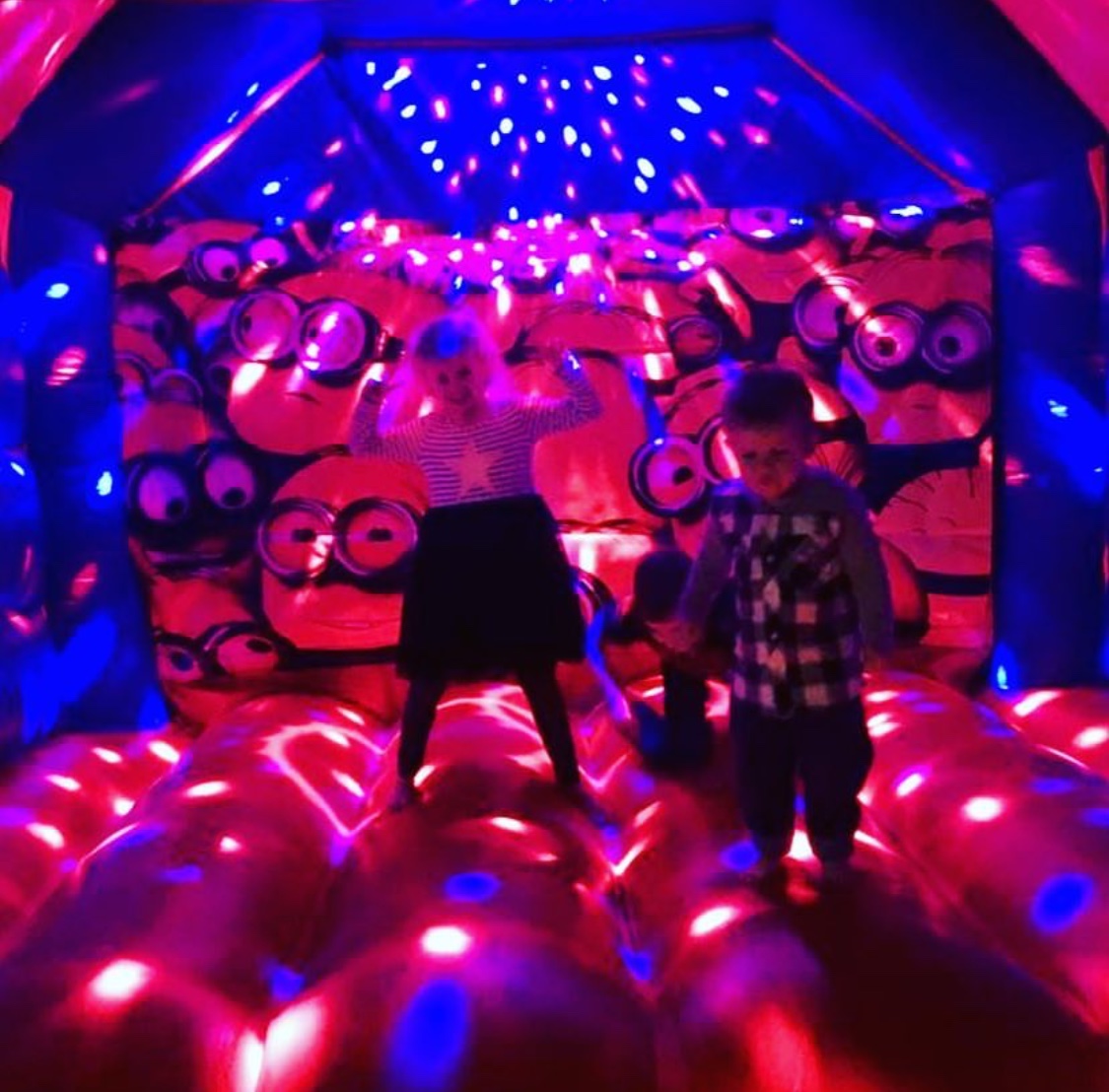Copy of Kids Dancing Under The Disco Lights On A Minions Bouncy Castle In Perth, WA