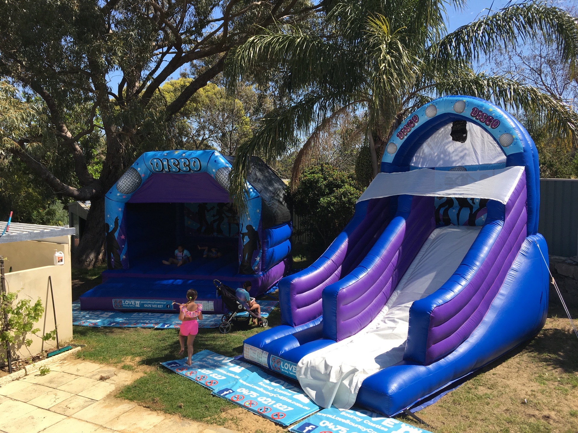 Copy of Double Party Hire. One Large Disco Bouncy Castle And One Inflatable Super Slide Set Up In Perth 