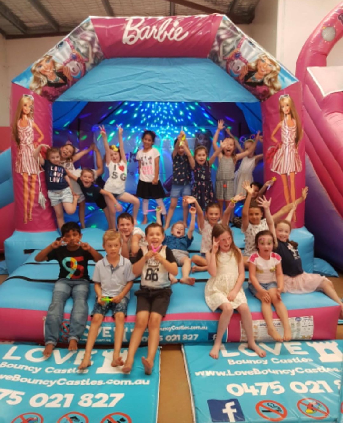 Copy of Kids Party With Children Playing On A Barbie Bouncy Castle That Was Hired Out In Perth