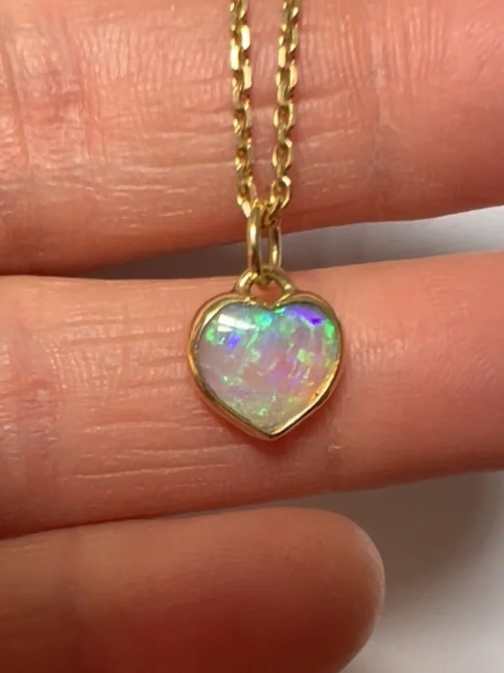 A unique one of a kind crystal opal heart set in 18k gold..

#opal
#opalheartnecklace 
#opalheartpendant
#shimmerandshine