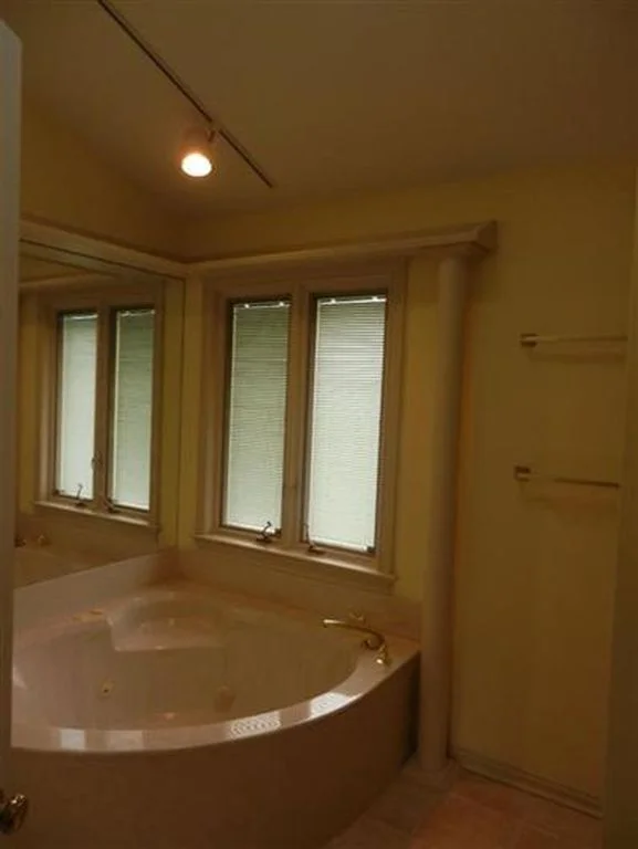 BEFORE: This massive jacuzzi tub took up the entire bathroom