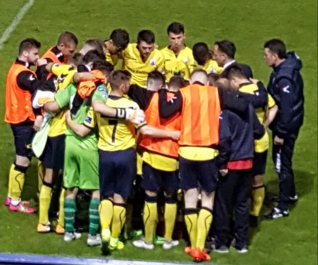 huddle-e1503570941934.jpg