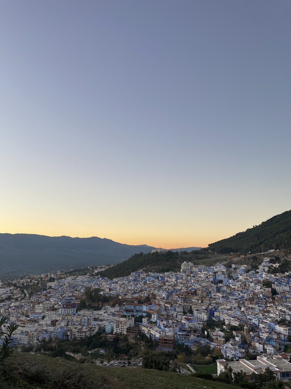  In Chefchaouen, the blue city, we hiked up to a mosque on the side of a mountain and took in this striking  tableau . 