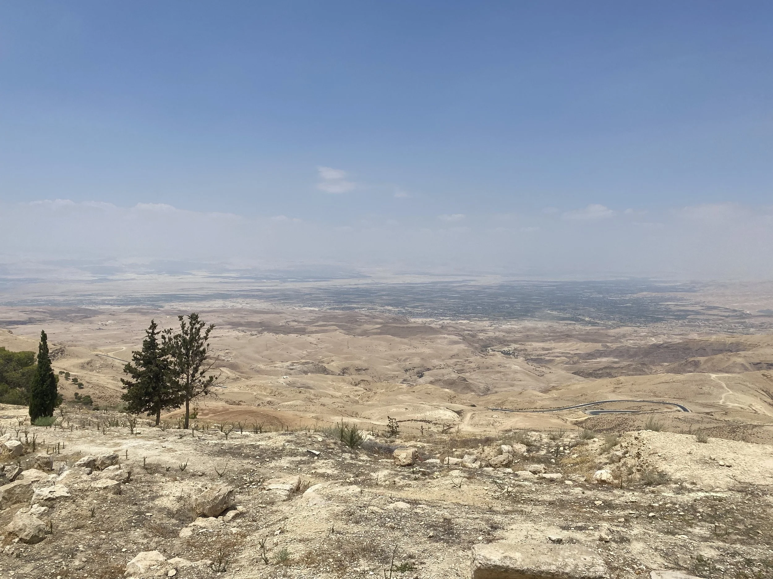   Looking off of Mt. Nebo, the majority of the Jordan Valley can be seen, including the Dead Sea and cities in Palestine. The drop to the land below is at least 3200 feet when you combine the height of Mt. Nebo above sea level and the depth of the Jo