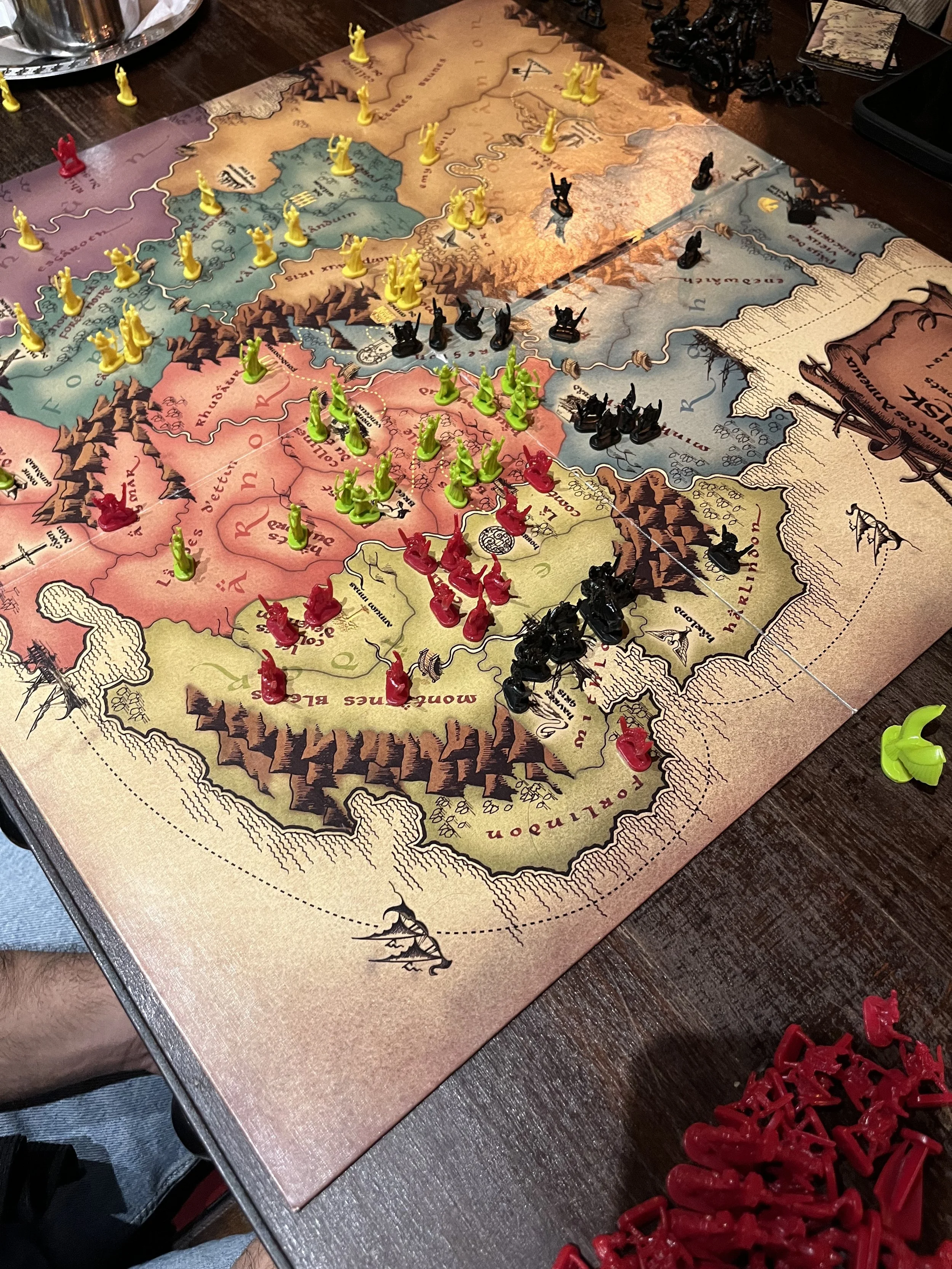 A photo taken from above shows a fantasy-themed board game set up for play.