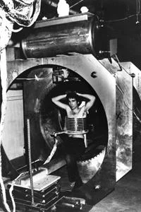 Lawrence Minkoff, PhD, post-graduate assistant, sitting in Raymond Damadian, MD’s self-built Indomitable MRI machine for the acquisition of the first-ever MRI image of a human, July 3, 1977.